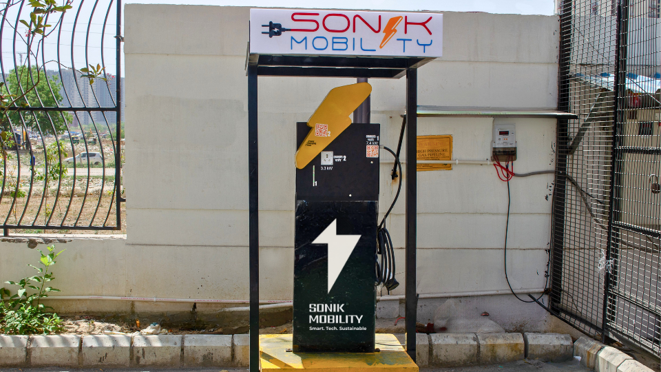 A row of EV chargers in a public parking area