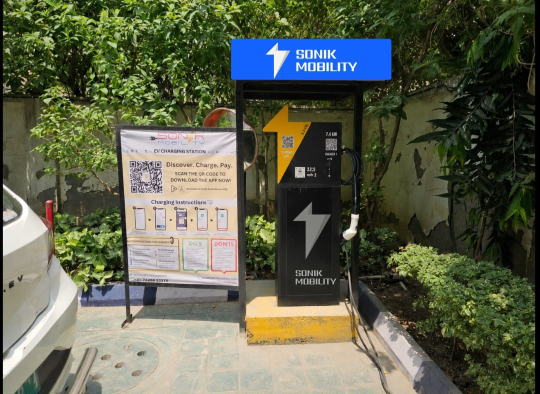 A row of EV chargers in a public parking area